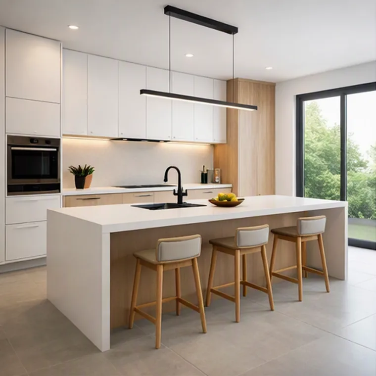 Modern kitchen with white quartz waterfall island, wood cabinetry and linear pendant light